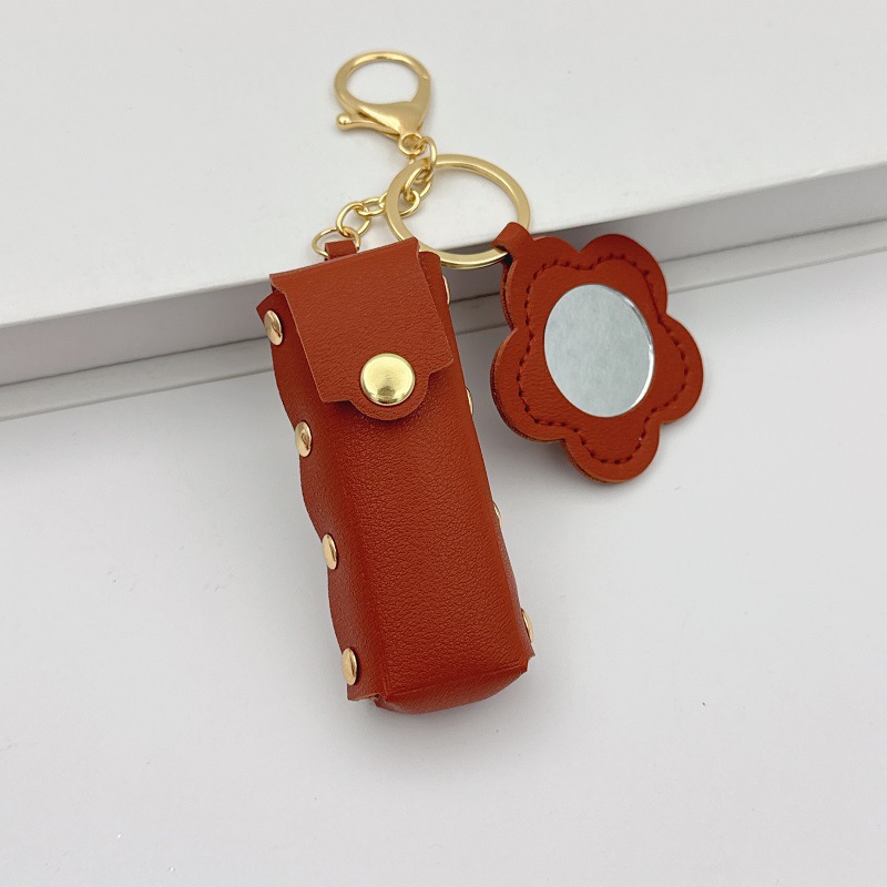 Flor espejo llavero cuero transfronterizo regalo colgante joyería creativo mini lápiz labial almacenamiento llavero colgante
