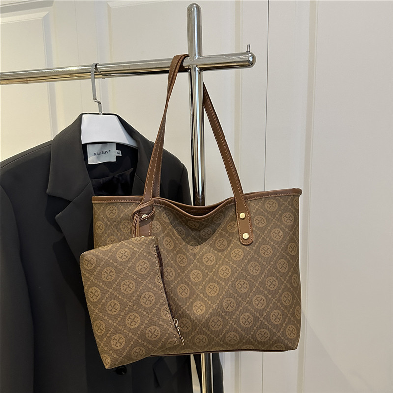 Nicho de diseño de alta sensación 2025 nueva moda versátil gran capacidad de hombro portátil bolso de mano de mujer