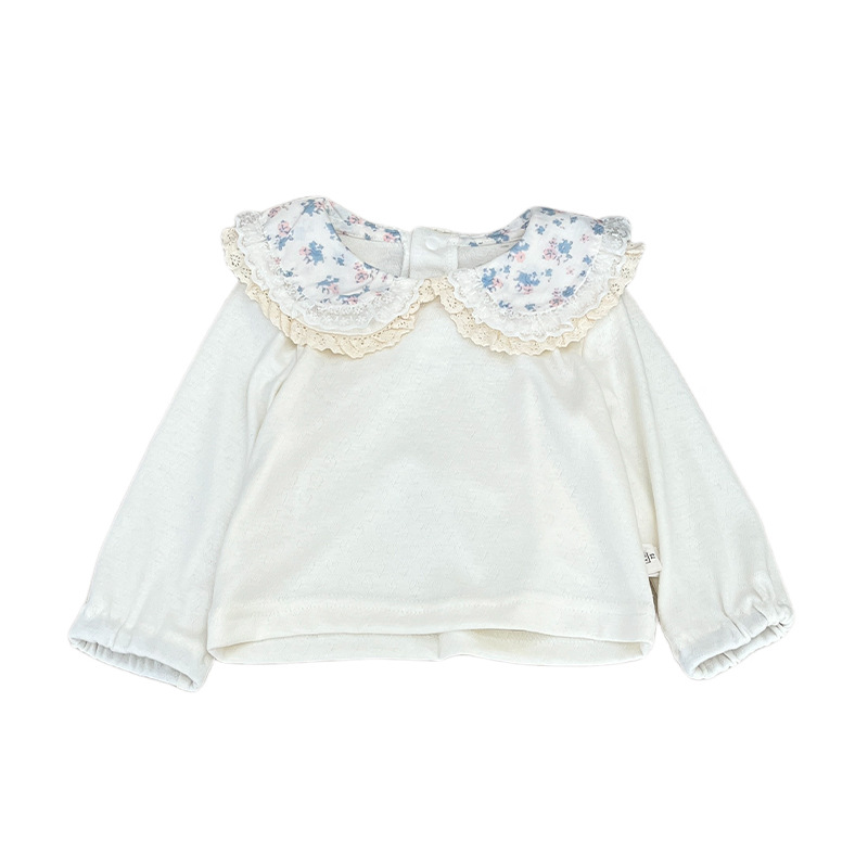 A principios de primavera, camiseta de manga larga de moda coreana para niñas, otoño extranjero, muñeca de flores trituradas cuello con camiseta de base superior