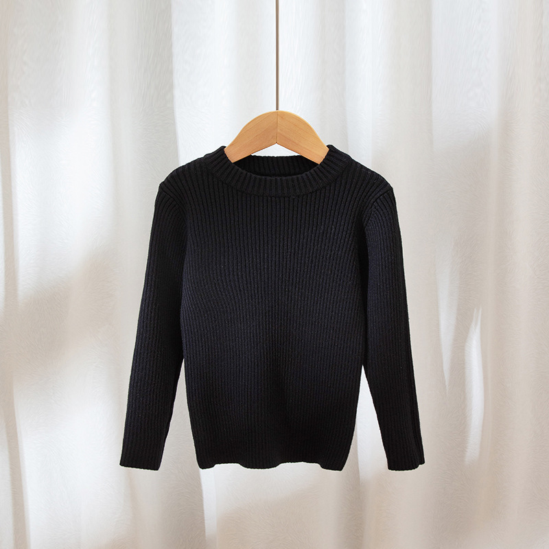 Suéteres infantiles 2025, nuevo estilo de otoño e invierno, ropa interior de punto para niños y niñas, suéter de cuello redondo versátil de color liso.