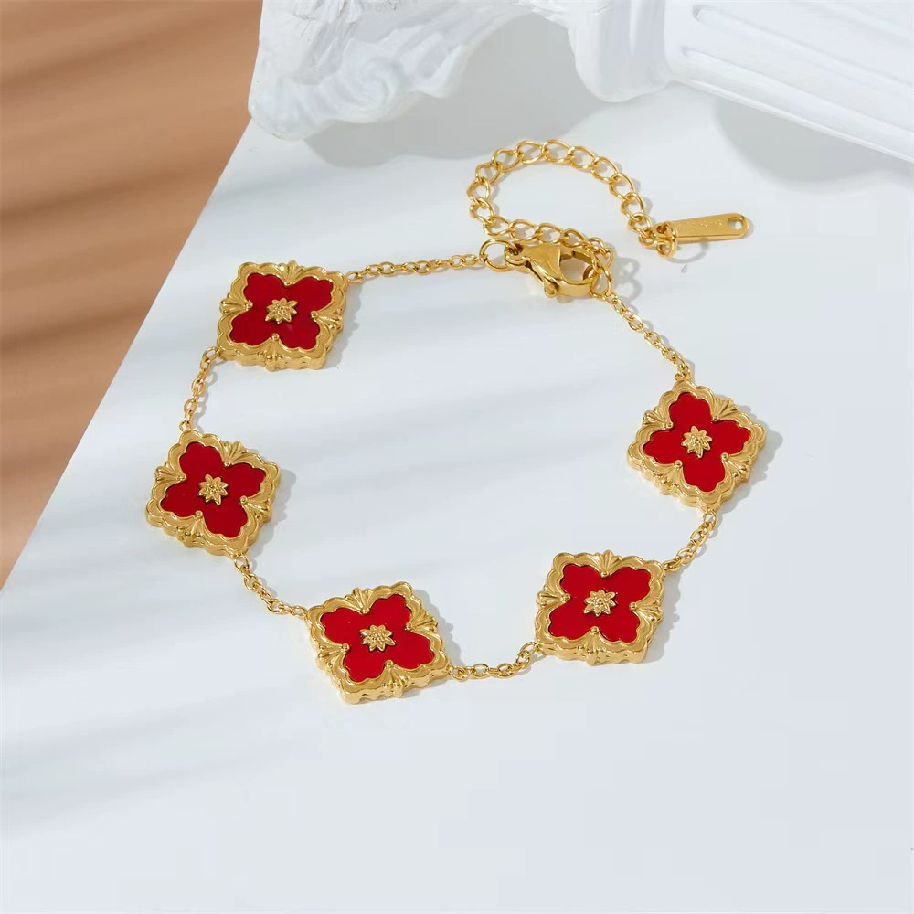 Pulsera de trébol de acero titanium vendedora caliente transfronteriza europea y americana con incrustaciones de concha pulsera colgante pulsera de diseño avanzado sin desvanecimiento al por mayor