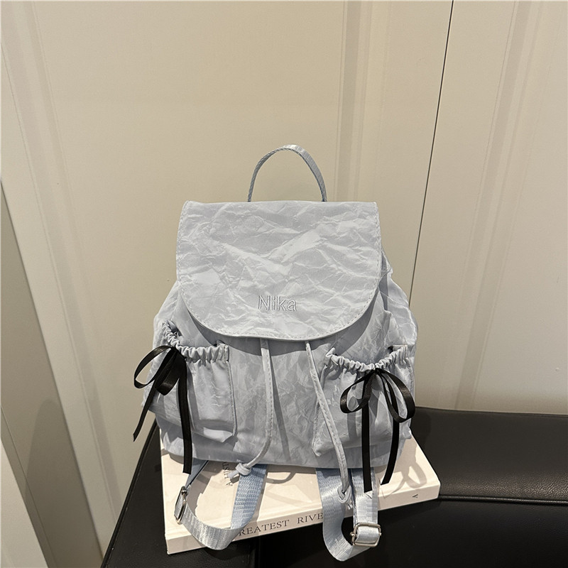 Mochila de lazo de sentido de alta gama para mujer 2025 nueva moda mochila de viaje mochila escolar casual para estudiantes coreanos