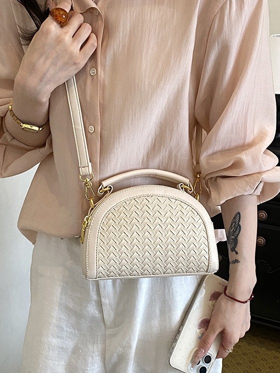 Fábrica de fuente al por mayor bolso semicircular leopardo mujer 2026 nuevo tejido empalme de alta calidad bolso de hombro