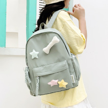 双肩包韩版五星挂件简约百搭背包大容量校园上课纯色学生书包批发