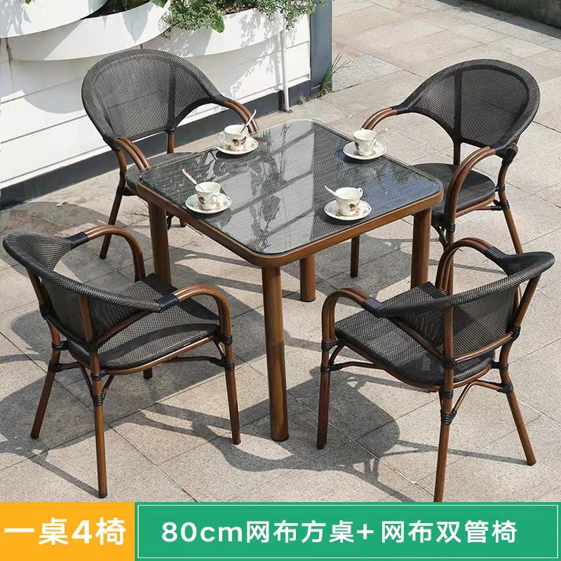 Mesa y silla al aire libre leche tienda de té cafetería silla de malla Silla de ratán Patio de tres piezas balcón mesa y silla de ocio al aire libre