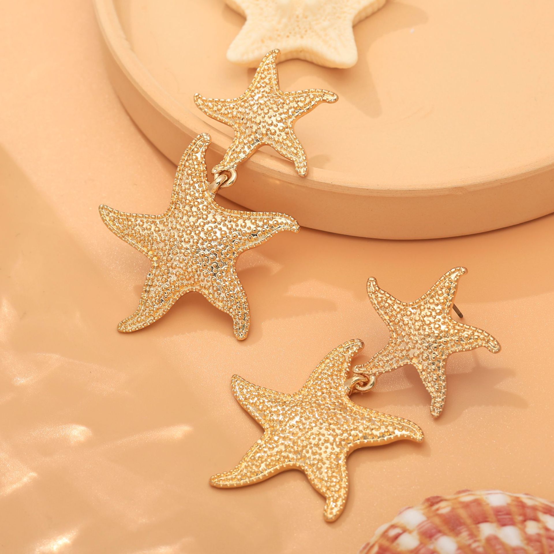 Pendientes de estrella de mar de viento de vacaciones de moda transfronteriza europea y americana Pendientes de aleación de doble capa de temperamento Accesorios de elementos marinos de verano para mujer