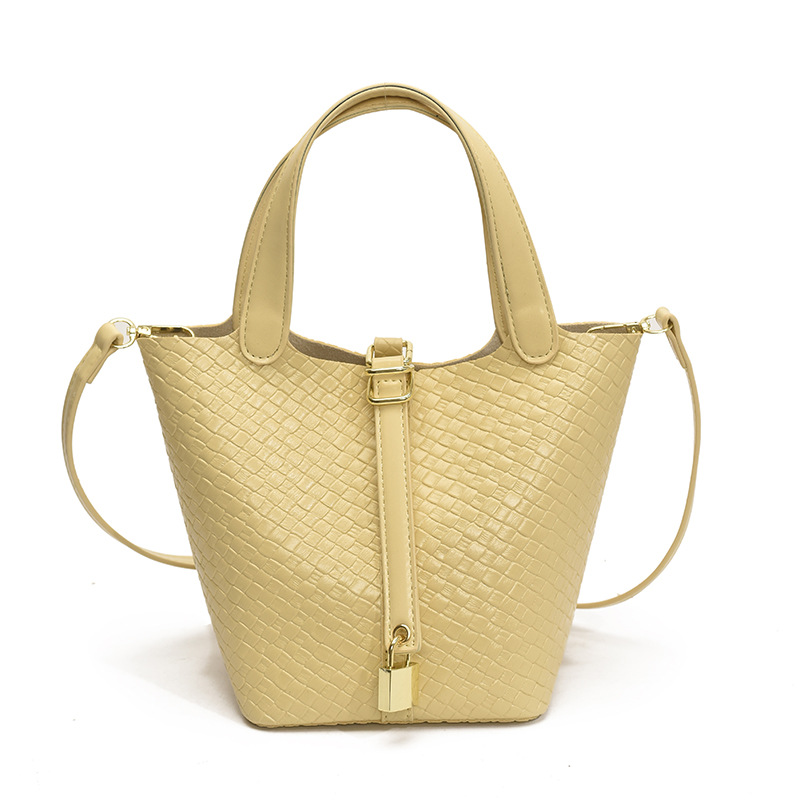 Bolso de cubo portátil con patrón tejido para mujer 2025 nuevo estilo coreano de lujo ligero de alta gama bolso de mensajero para niños de nicho