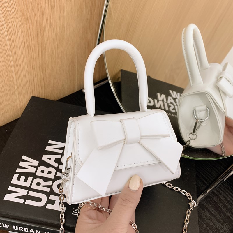 Bolso de mujer 2025 tendencia de primavera nuevo arco de moda para niños bolso de hombro de estilo extranjero bolso de mano