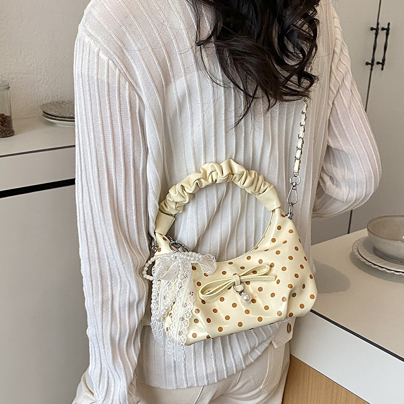 Coreana estilo extranjero suave bolso plegable mujer verano 2026 nueva moda diaria cadena mochila de hombro