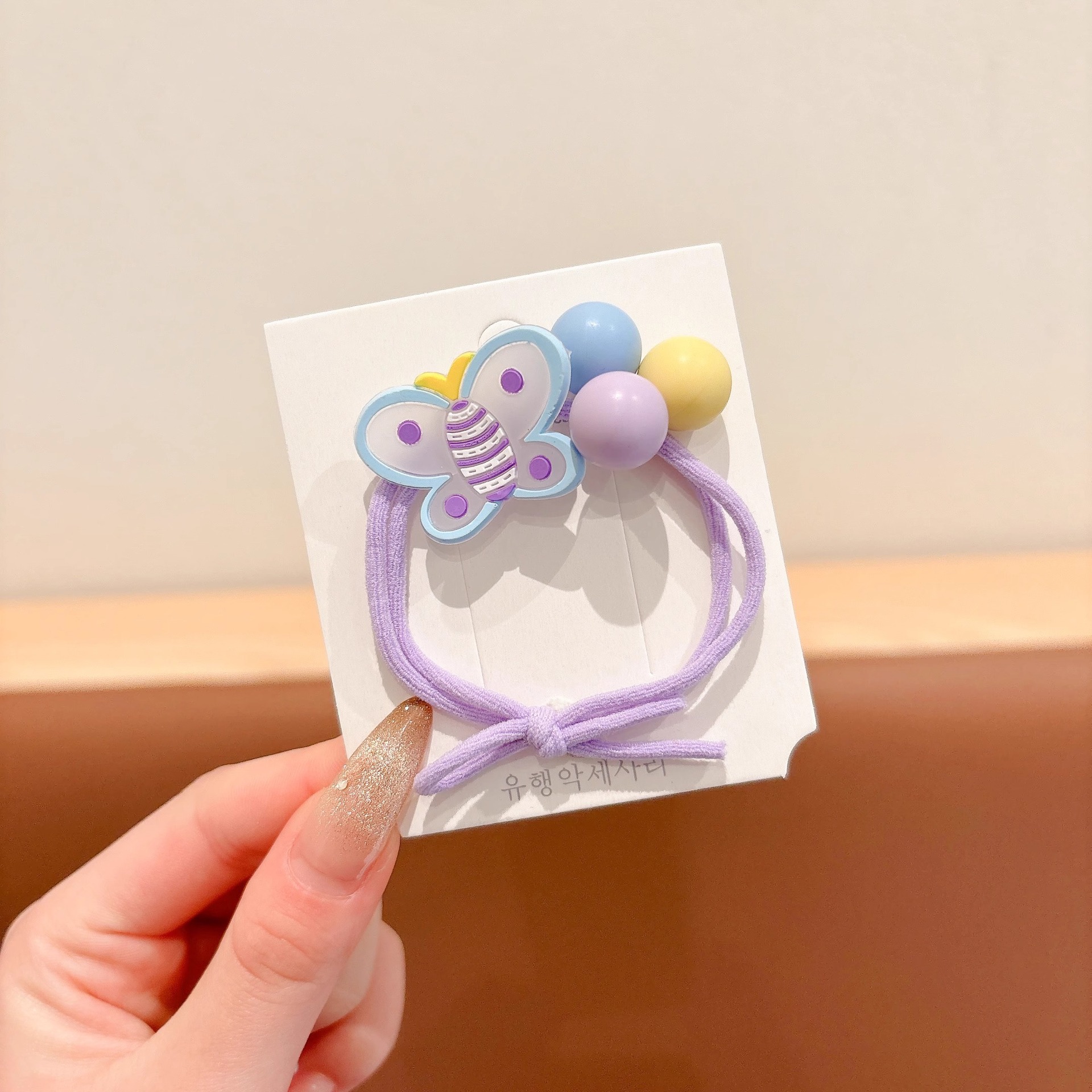 2025 nueva mariposa cuerda de cabello niñas atadas bolas correa de cabello no daña cabello alto valor de la cara cuerda de cabello joyería para el cabello de niña