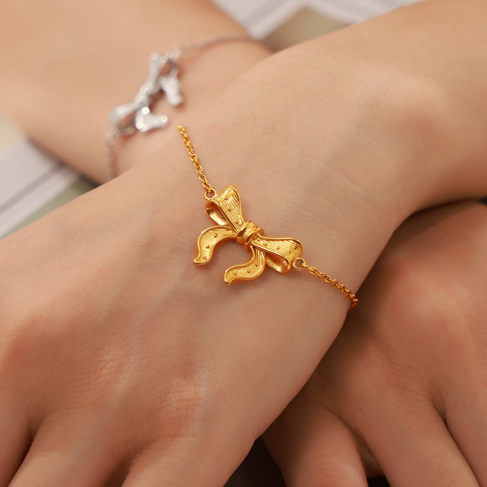 Temperamento de viaje moderno, diseño de joyería elegante y sencillo, colgante de lazo, conjunto de joyería de acero de titanio._voghion.com