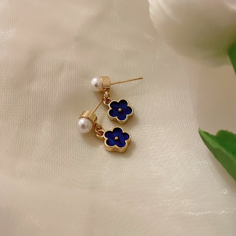Luz de lujo de alta calidad pendientes de moda pendientes de temperamento fábrica al por mayor Aguja de plata azul cristal flor perla pendientes