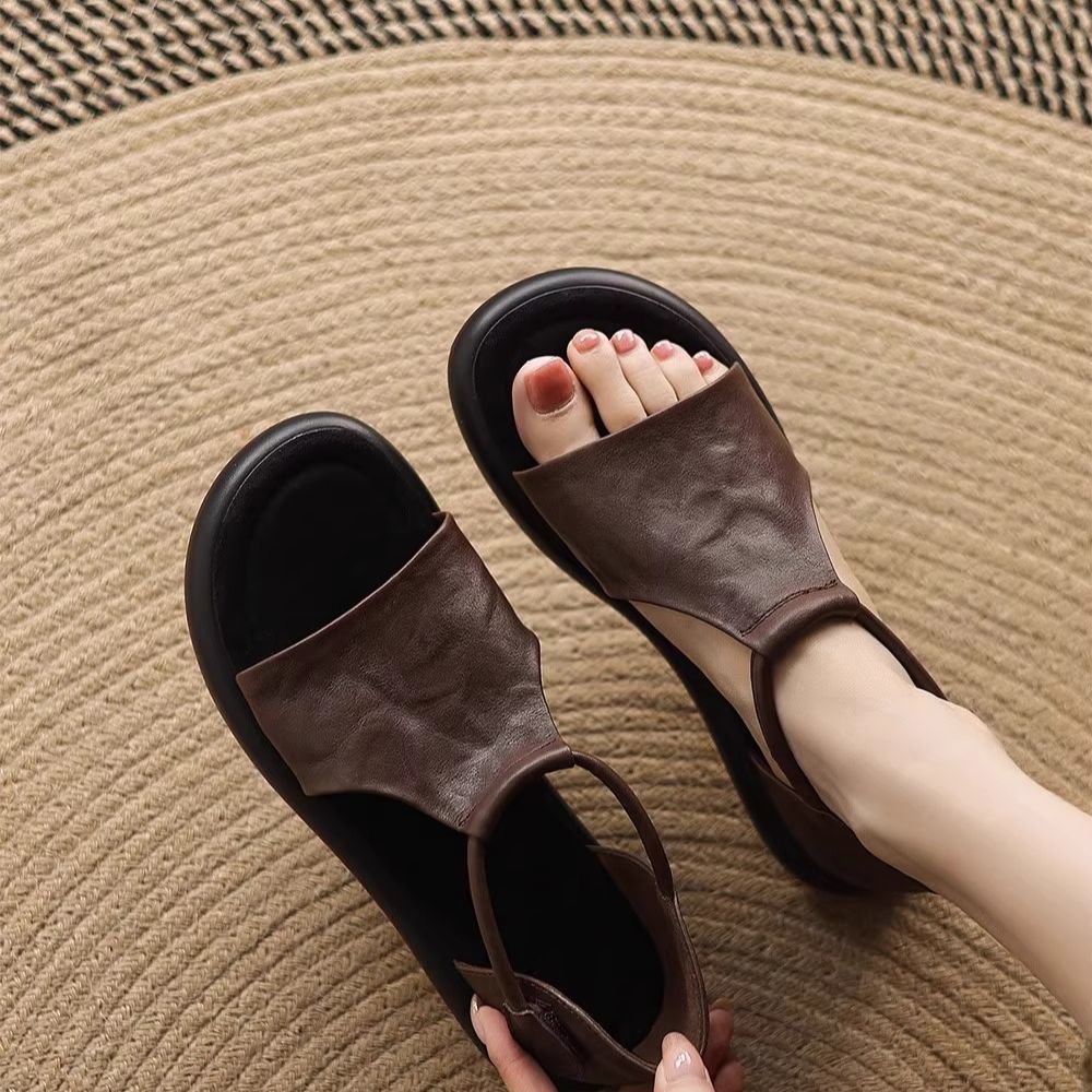 Nicho retrógrado sandalias de dedos desnudos para mujeres de verano 2026 nuevo hueco casual cómodo zapatos romanos planos