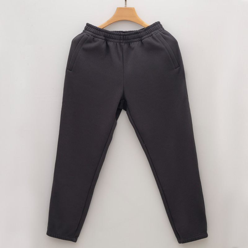 Nueva cremallera bolsa de lana forrado pantalones de chándal de los hombres y las mujeres otoño y el invierno suelto nuevo tobillo-atado de algodón casual espesado caliente pantalones hombres