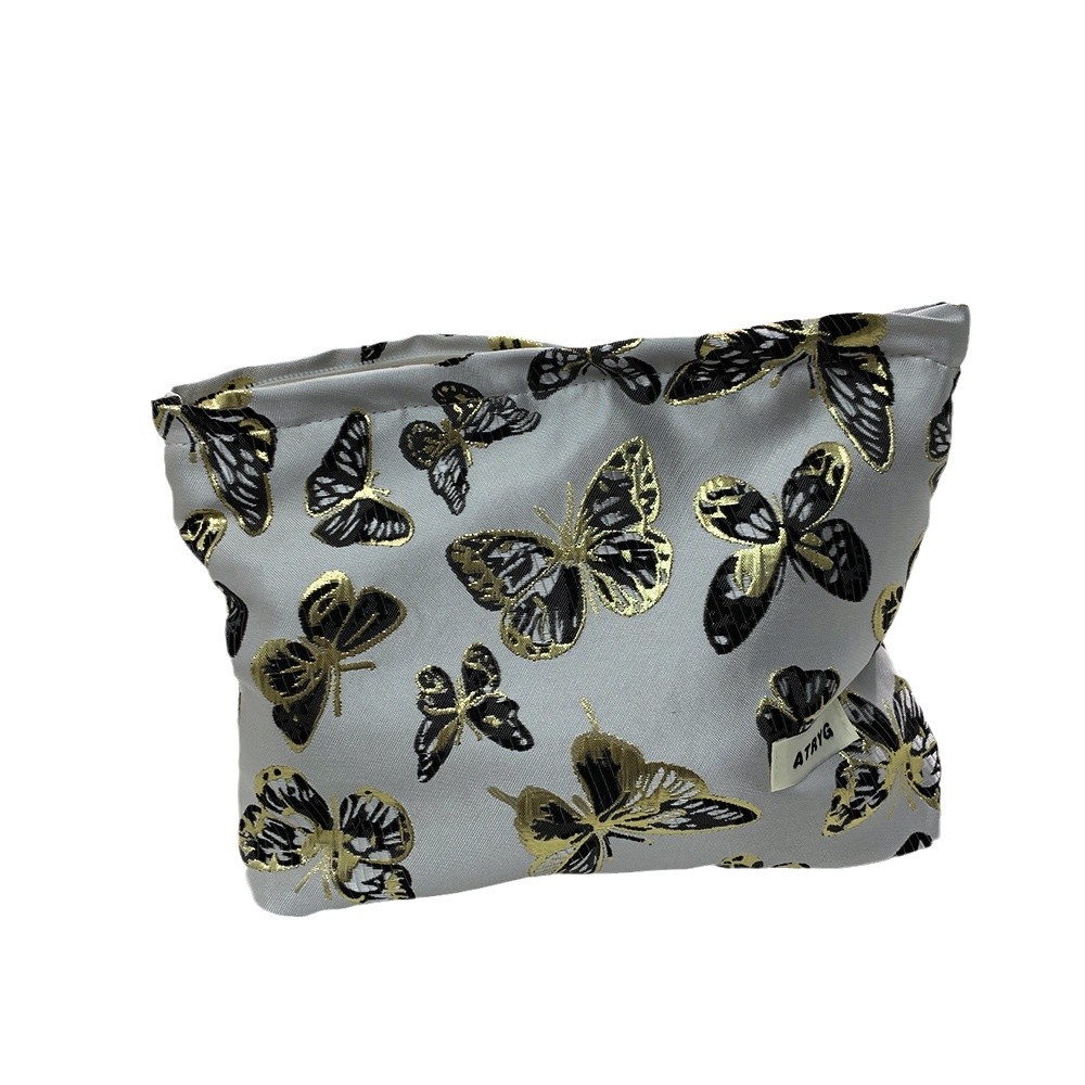 Bolsa de maquillaje de mariposa transfronteriza, bolsa de almacenamiento portátil para productos de cuidado de la piel, bolsa de lavado de viaje, bolsa cuadrada, bolsa de mano