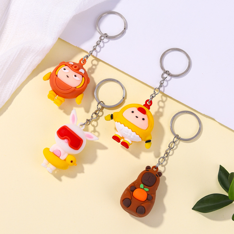 Nuevos llaveros de dibujos animados Capibara conejo blanco huevo colgante de fiesta mochila decoración