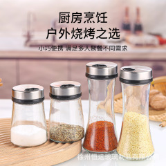 台所の多孔性ステンレスの調味料の瓶は瓶の塩の缶のガラスの調味料の瓶の家庭のセットの胡椒の粉の調味料の缶を撒きます。
