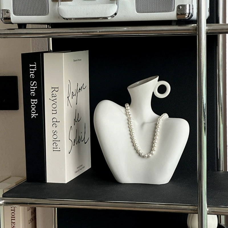 Элитные украшения, художественные и креативные керамические вазы в форме человеческой ключицы, входные столешницы, дизайнерские украшения ниш в гостиной.