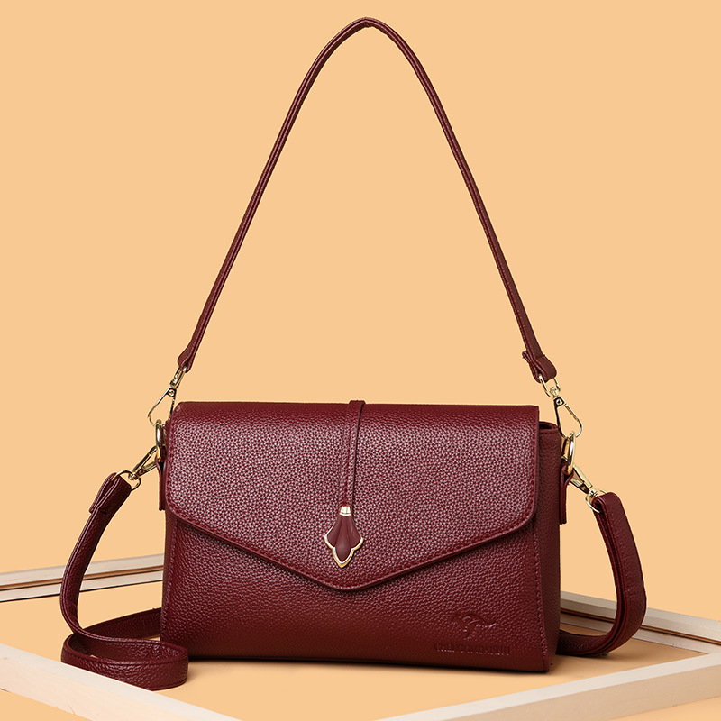 Bolso de moda para mujeres 2026 nuevo bolso pequeño de cuero suave bolso de madres de mediana edad bolso de hombro de gran capacidad bolso de mochila