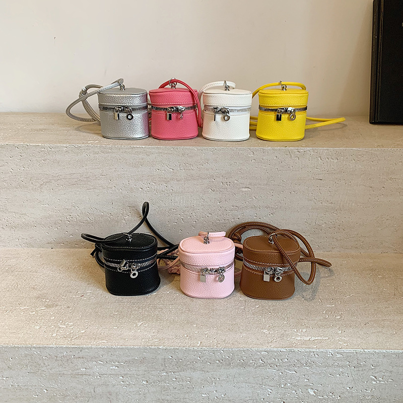 Bolso de hombro para niña coreana simple color sólido mini lindo bolso de cubo para bebé 2025 nuevo bolso de auriculares para niños marea