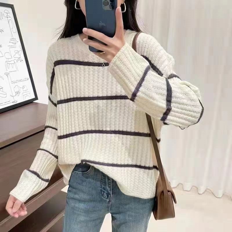 Autumn demi-season knitted sweater with a round collar