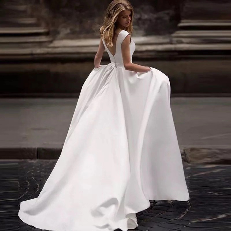 Europa y los Estados Unidos comercio exterior vestido de boda verano 2026 nueva novia de cola sexy delgada satén simple moda de viaje