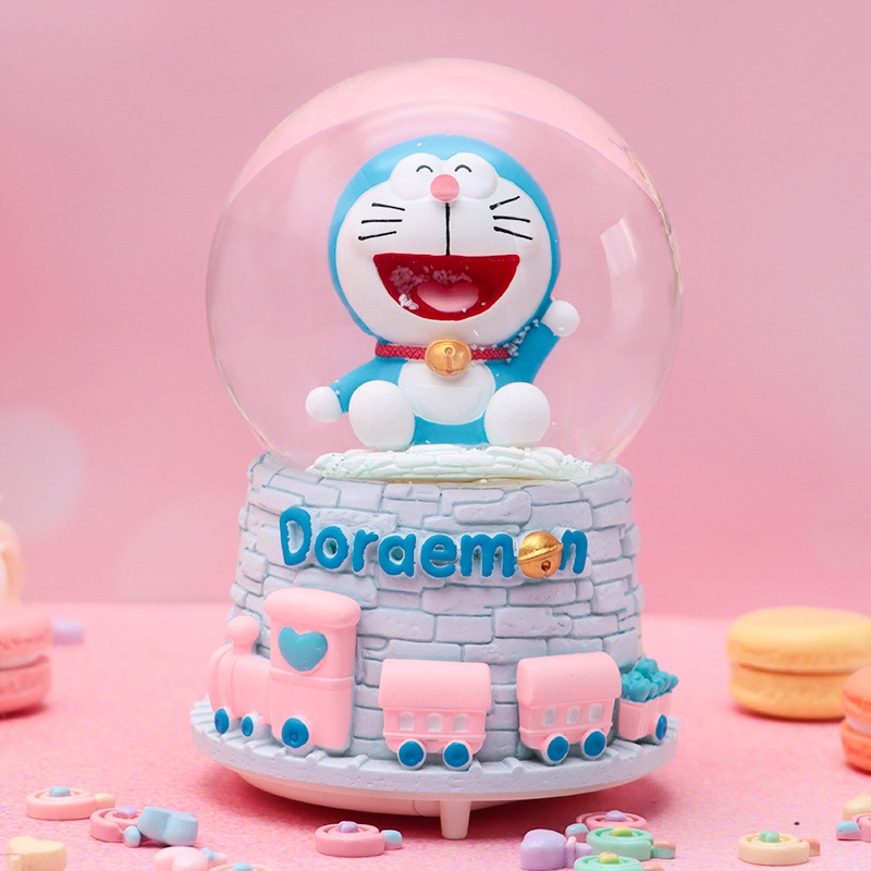 Linda campana tren azul gordo bola de cristal caja de música para niños y compañeros de clase regalo caja de música de nieve brillante