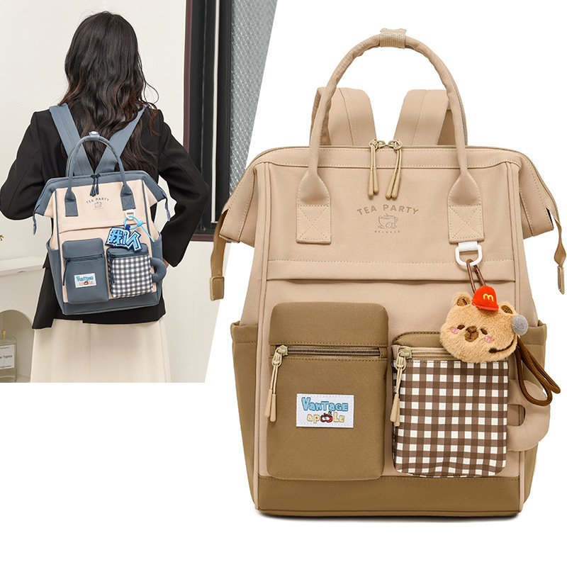 Bolsa de maternidad estilo japonés, de gran capacidad y alta estética, mochila para estudiantes, bolsa de maternidad portátil para exteriores, mochila de doble asa al por mayor.