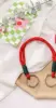 One red rope with two buckles