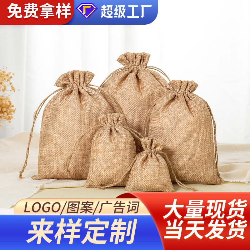 国境を越えて卸売りして麻布の袋のクリスマスの麻の袋をまねて縄を引いて袋のクリスマスの贈り物の袋を縛って注文します。|undefined