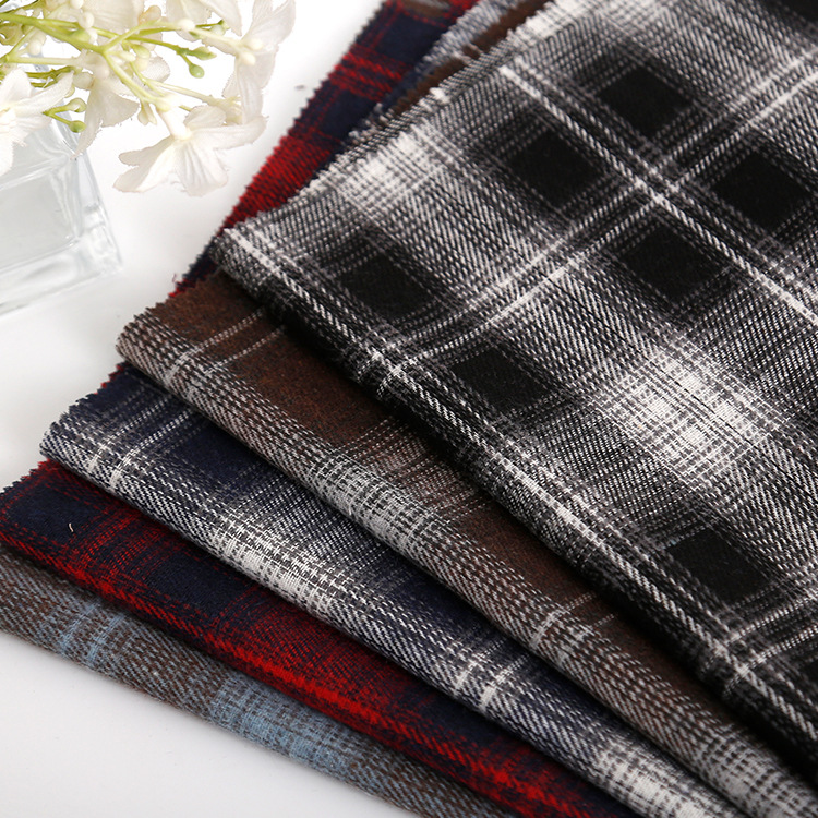 现货直销涤棉磨毛色织格子面料 春秋长裤男女童装衬衫鞋服格子布