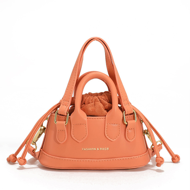2022 Otoño e Invierno Nueva textura de los niños bolso de mano de moda europea y americana mini bolso de la cáscara transfronteriza bolsa de las mujeres