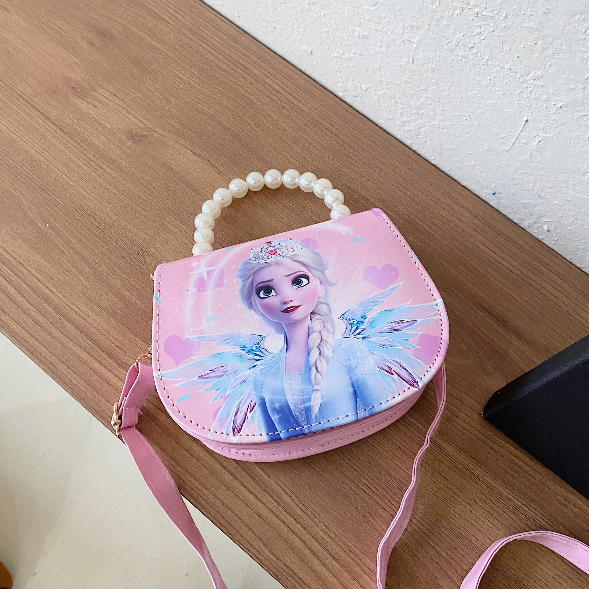 2024 nueva bolsa de hombro para niños princesa Elsa dibujos animados Yue Gui perro coreano nicho perla bolsa de mano inclinada