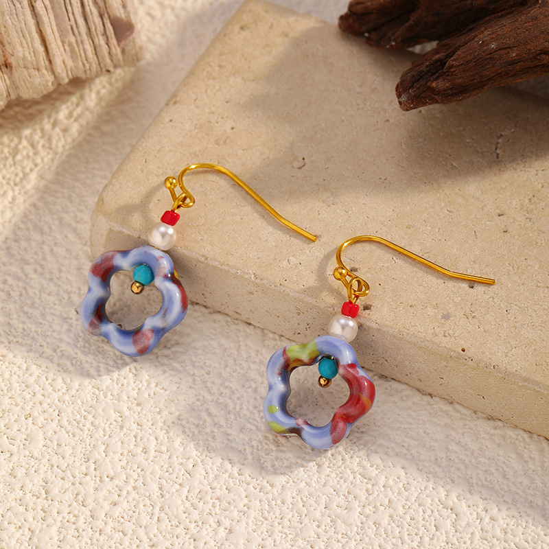 Europa y los Estados Unidos más vendidos antiguos aretes de cerámica azul y flor serie de aretes de cerámica nuevos aretes de estilo chino diseño temperamento estilo anillo redondo