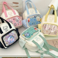 かわいい学生のショルダーバッグ男女のリュックサックの学生は韓国版の簡単でファッション的なカバンのナイロンの布の斜めの食事量の痛みのカバンを包みます。