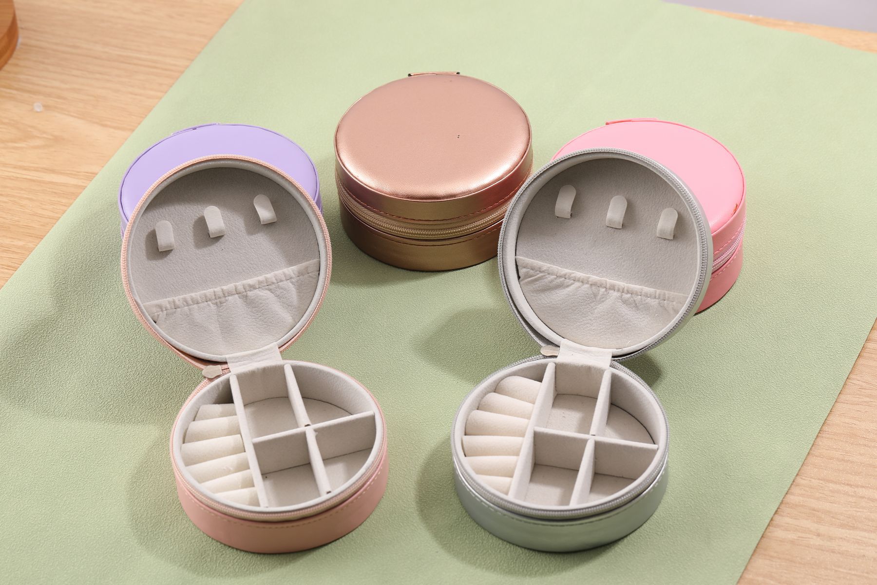 Runde tragbare Schmuckschatulle PU Schmuck-Aufbewahrungsbox Schmuck-Ohrringe-Ring-Organizer grenzüberschreitender Bestseller für den Außenhandel