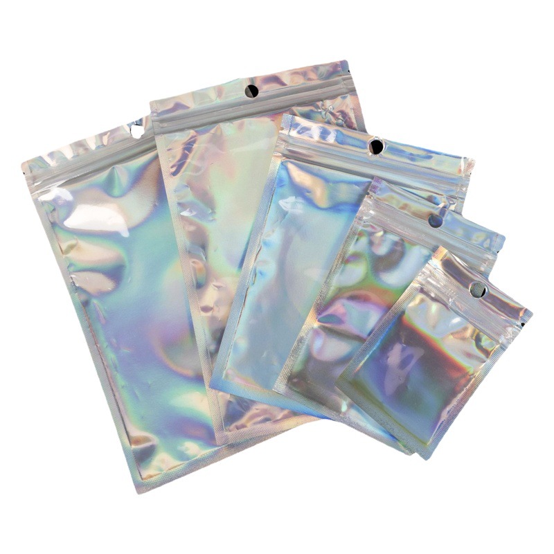 Bolsa de Láser Color mágico láser ziplock bolsa sellada bolsa de papel de aluminio Yin y Yang bolsa de teléfono móvil Shell belleza joyería bolsa de embalaje al por mayor