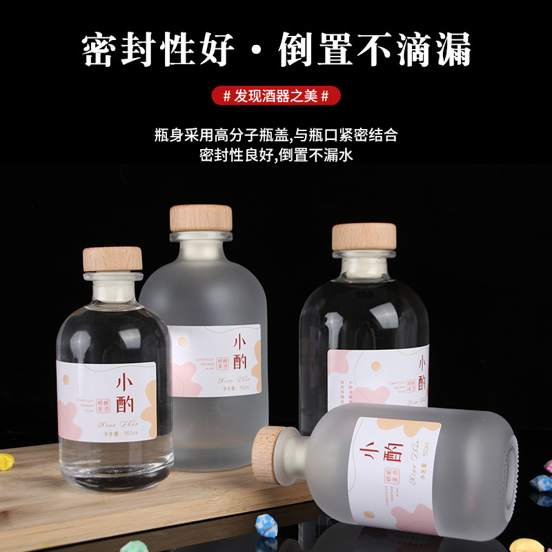 Botella de vidrio esmerilado transparente al por mayor botella de vino de fruta casera de cerveza botella de vino vacía botella de vodka botella de vino de ciruela cubierta de madera