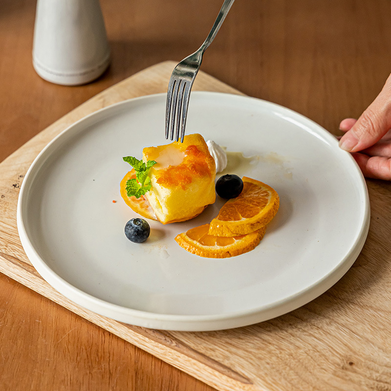 Plato plano de cerámica de estilo nórdico Plato redondo exquisito para el hogar Plato de carne occidental Plato de pasta Plato de vajilla Plato al por mayor