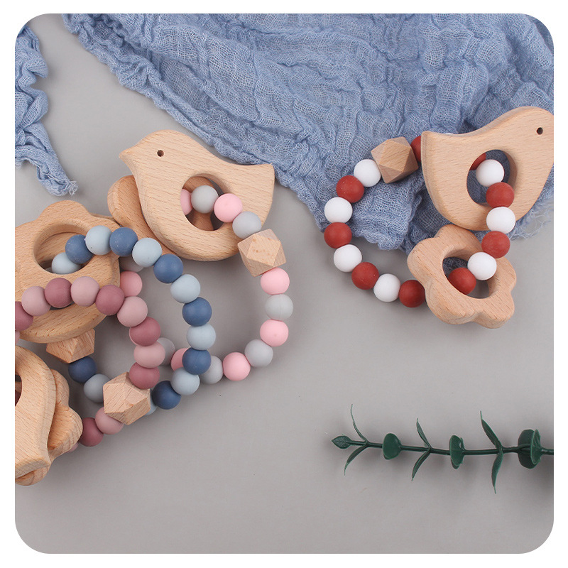 Nuevo bebé dibujos animados pájaros pulsera de madera de haya juguetes creativos pulsera de dientes de silicona pulsera de dientes