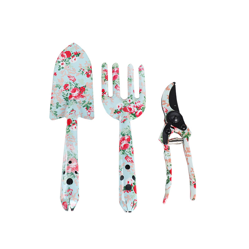 Herramientas al aire libre textura de impresión de flores pequeñas herramientas de jardín conjunto de tres piezas de impresión pala jardín flores y plantas herramientas de jardinería