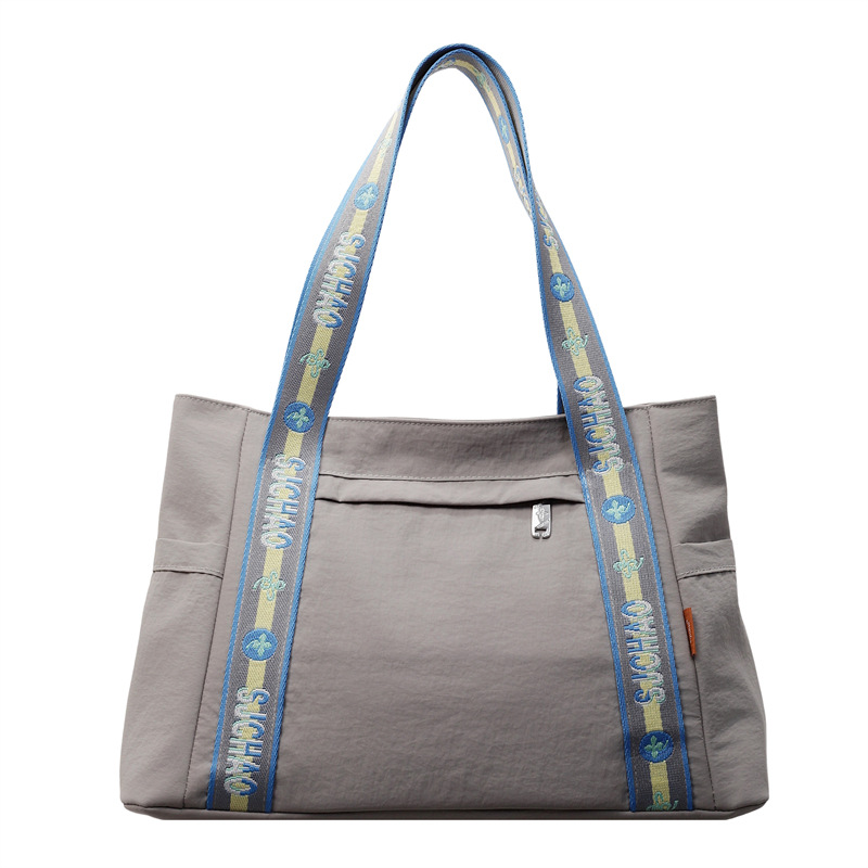 Bolso Tote portátil horizontal de tela de nailon para mujer 2025 nueva moda casual todo fósforo bolso de hombro de trabajo