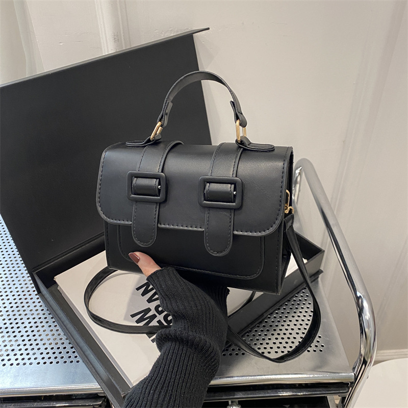 Bolsa de hombro de invierno de color extranjero para mujeres 2024 nueva moda mochila de tela de empalme elegante bolso de mano