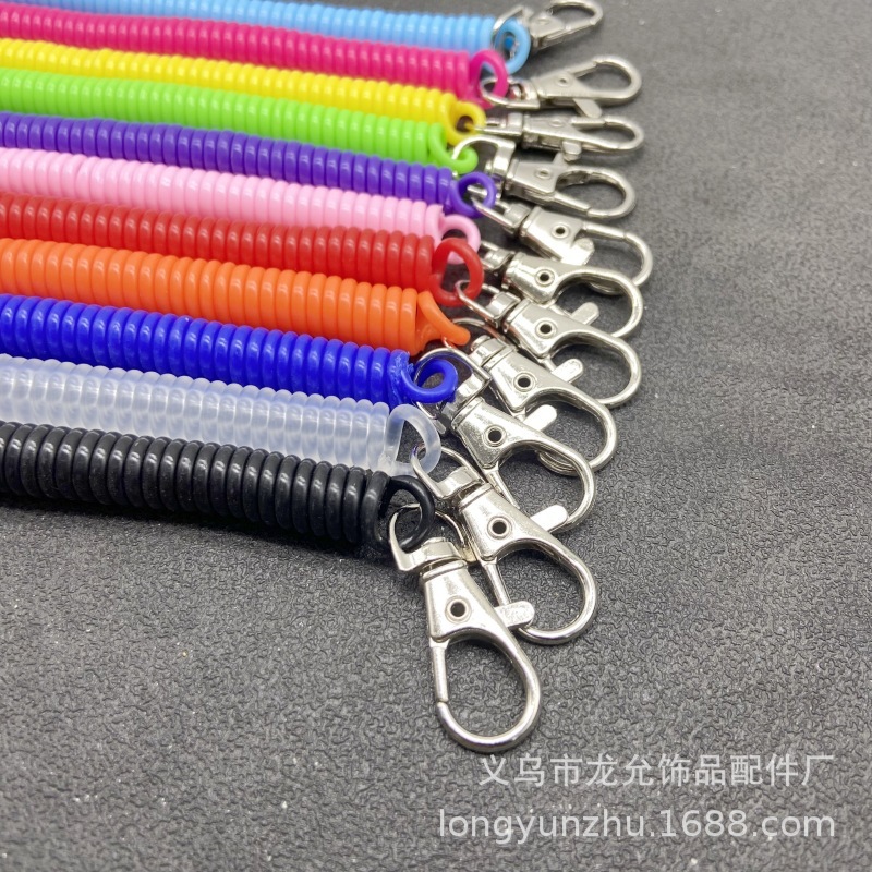 キャンディー色の高弾プラスチックは電話線のスプリングロープのキーチェーンをなくして携帯電話のカードカバーストラップのキーチェーンを包みます。|undefined