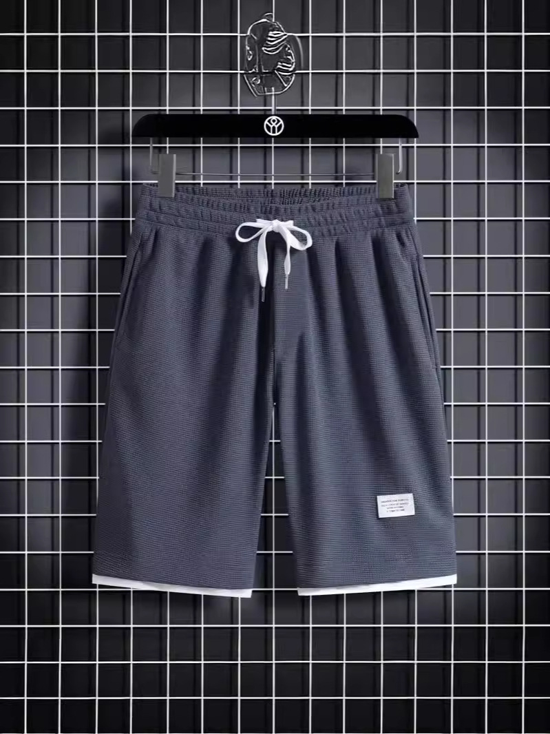 Camisa menos ropa Waffle pantalones de cinco puntos para hombres verano nuevo estilo estilo Hong Kong pantalones cortos de dos piezas falsos de color recto suelto