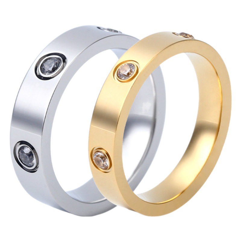 カードの家の同じタイプの六ドリルの一字のチタン鋼の男女の指輪の優雅な気質はドリルのステンレスの指輪の装飾品を入れて注文します。
