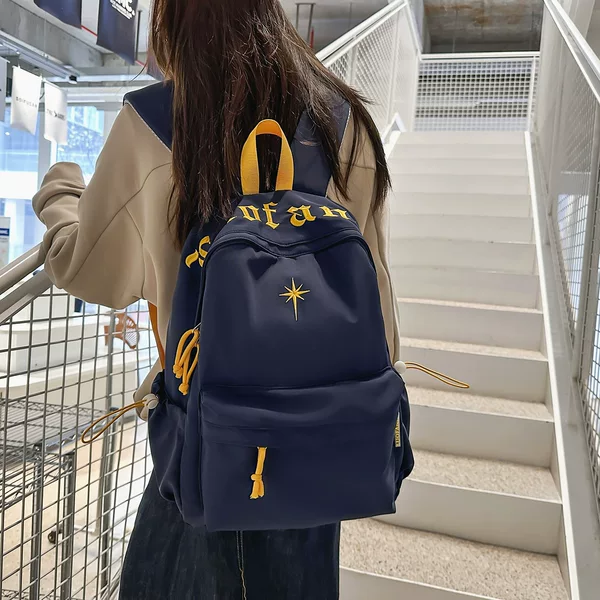 Simple solid color letter embroidered backpack, large capacity, lightweight, suitable for both male and female students, for travel and commuting