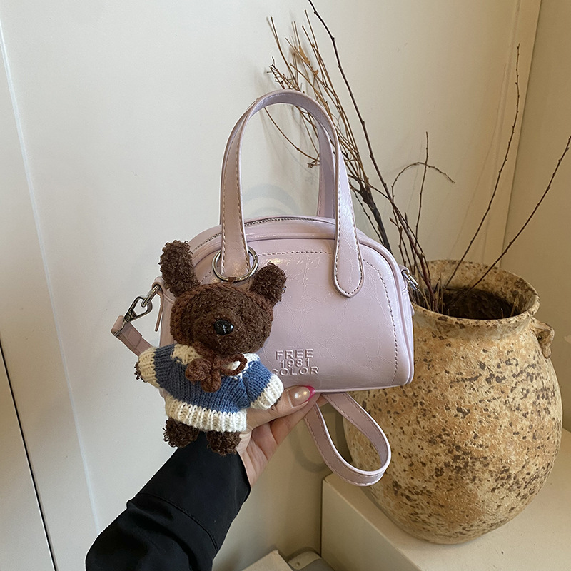 Bolsa de conchas para mujeres 2026 nuevo tipo de bolso de hombro portátil de viaje universal nicho de diseño diario bolso de mano