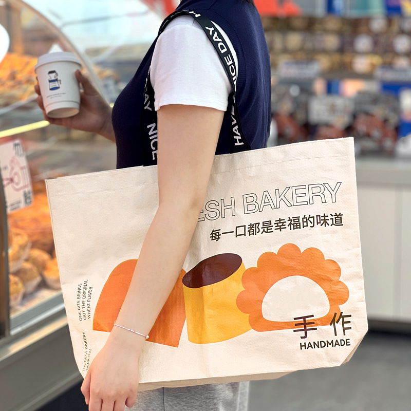 网红卡通手提编织袋批发烘焙店开业活动展会打卡防水购物袋显眼包