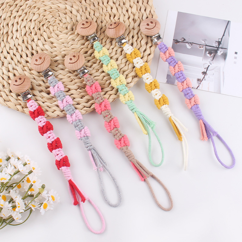 Productos para bebés de beech sonriente clip de tetina creativo puro tejido a mano cuerda de tetina de textura de arco anti-caída cadena
